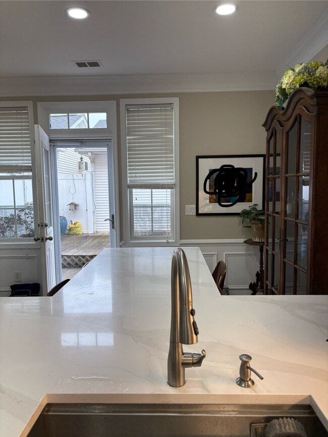 Gorgeous new quartz countertops with island table and 4 bar stools for dining. - 163 Singleton Rd