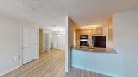This 850 square foot apartment at Breyley Apartments offers a well-designed living space with two bedrooms and one bathroom. The unit features a thoughtful layout, maximizing functionality and comfort. Upon entry, you're greeted by an open-concept living and kitchen area, perfect for entertaining or relaxing.

The kitchen boasts modern appliances, including a refrigerator and dishwasher, complemented by light wood cabinetry and neutral-toned countertops. The living room seamlessly connects to the kitchen, creating a spacious feel and allowing for easy interaction between spaces.

Both bedrooms are generously sized, with the primary bedroom measuring 200 square feet. Each room features large windows that flood the space with natural light, creating a bright and airy atmosphere. The bathroom is equipped with essential fixtures and includes accessibility features such as grab bars.

Throughout the apartment, you'll find high-quality vinyl plank flooring that mimics the warmth of hardwood while offering durability and easy maintenance. The neutral color palette of the walls provides a blank canvas for personal decorating styles.

Additional features include ample closet space, window blinds for privacy, and modern lighting fixtures. The apartment's layout efficiently utilizes the 850 square feet, ensuring a comfortable living environment without feeling cramped. Its ground-floor location offers convenient access and a connection to the surrounding community.