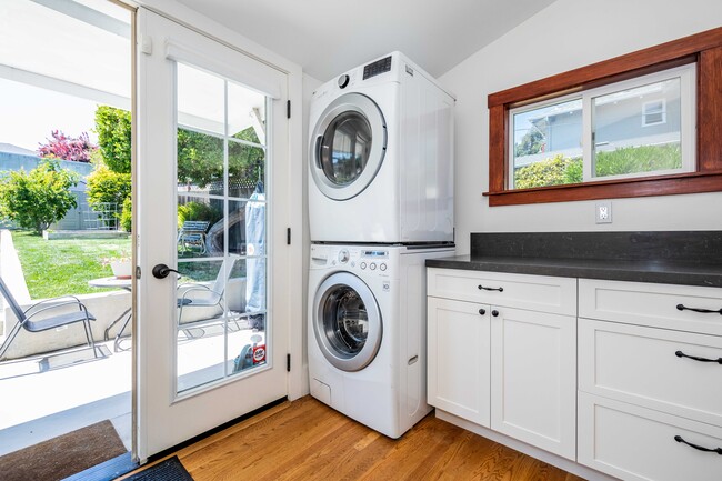 Newly renovated kitchen with washer and dryer. - 431 Athol Ave