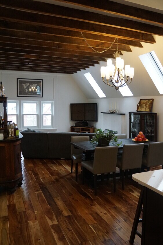 The main space is massive - great for entertaining, but also makes a great everyday space, bringing together the family room, dining room and kitchen - 5504 Hays St.