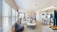 Located at 2400 Watermark Blvd in Oklahoma City, OK, this thoughtfully designed 3-bedroom, 3-bathroom home offers a comfortable and functional single-floor layout. The open-concept living area is bright and welcoming, featuring plush carpeting, large windows with abundant natural light, and a seamless flow into the dining area. The kitchen is a standout, showcasing gray shaker-style cabinetry, marble-look countertops, a breakfast bar island, light wood-style flooring, and a full suite of stainless steel appliances including a refrigerator with ice maker, range, microwave, and dishwasher. The primary bedroom is a comfortable retreat with a ceiling fan, carpeted flooring, and direct access to both a private bathroom and a walk-in closet. Additional bedrooms are well-sized with ceiling fans and ample natural light. Each of the three bathrooms is finished with marble-look countertops, gray cabinetry, and decorative patterned tile flooring. Two closets provide convenient storage throughout the home. The overall aesthetic is clean and modern, with a neutral color palette, consistent finishes, and a bright, airy ambiance that carries throughout every room.