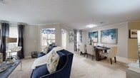 Located at 3475 Pleasant Hill Rd in Duluth, GA, this well-designed single-floor residence offers 2 bedrooms, 4 bathrooms, and a thoughtfully organized layout. The open-concept living and dining area is a standout feature, with plush carpet, crown molding, a textured ceiling, and multiple windows fitted with blinds and decorative curtains that allow generous natural light throughout. The adjacent kitchen is fully equipped with rich wood cabinetry, granite-style countertops, stainless steel appliances, and wood-look flooring, making it both functional and visually appealing. A separate dining room provides a dedicated space for formal meals. The spacious primary bedroom features carpeted flooring, a large window with outdoor views, and ample room for a full furniture suite. The second bedroom is similarly comfortable, with soft carpeting and wall space for artwork. Four bathrooms serve the residence, including one with a tiled soaking tub and wood-look flooring, and another with a dark wood vanity, granite countertop, and decorative mirror. A dedicated in-unit laundry room with full-size washer and dryer adds everyday convenience. Two closets provide additional storage throughout. The overall ambiance is calm and neutral, with warm tones and contemporary finishes defining each room.