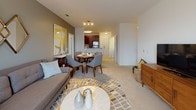 Located at 460 River Rd in Andover, Massachusetts, this single-floor residence offers a well-designed layout that balances comfort and modern style throughout. The open-concept living and dining area is anchored by plush carpeting, neutral tones, and a large window that invites natural light and outdoor views, creating a bright and welcoming atmosphere. The space flows seamlessly into a dedicated dining area, ideal for entertaining.

The kitchen is thoughtfully appointed with rich dark wood cabinetry, granite countertops, a classic tile backsplash, and a full suite of stainless steel appliances, including a gas range and built-in microwave. Tile flooring adds a clean, durable finish to this functional culinary space.

Multiple bedrooms provide restful retreats, each featuring soft carpeting, generous windows with sheer drapery for natural light, and stylish accent walls in muted gray tones. The rooms offer ample space for furnishings and personal touches.

The bathroom is a standout feature, showcasing a double-sink vanity with warm wood cabinetry, sleek chrome hardware, white quartz countertops, and large wall mirrors. Light tile flooring completes the clean, contemporary aesthetic. Throughout the residence, a cohesive design palette and quality finishes create an inviting and functional living environment.