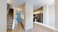 Located at 101 Missouri Ct in Harrisburg, PA, this three-bedroom, three-bathroom home is spread across three floors, offering a well-organized layout with dedicated spaces for living, sleeping, and storage. The main level features an open-concept kitchen and living room area, where white shaker-style cabinetry, stainless steel appliances, and a granite-look countertop with an integrated sink create a functional and clean culinary space. Light wood-tone LVP flooring and ceiling fans carry throughout the main living areas, contributing to a bright, cohesive aesthetic. The bedrooms are finished with plush carpet, neutral-toned walls, and ceiling fans. The primary bedroom includes a double-door closet and an additional door for added convenience. Bathrooms are appointed with white vanity cabinetry, brushed nickel hardware, and wood-look flooring, with at least one full bath featuring a tub/shower combination. The unfinished basement presents a versatile opportunity, with concrete flooring, a small egress window, and partially framed walls with drywall already in progress—offering potential for future customization. Each floor provides a progressively intimate footprint, making efficient use of the overall square footage across the home's three levels.