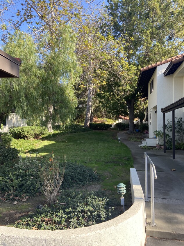 Walking to the front door (on the right) and laundry room is two doors down. Shared with only a few - 1046 Miramonte Dr