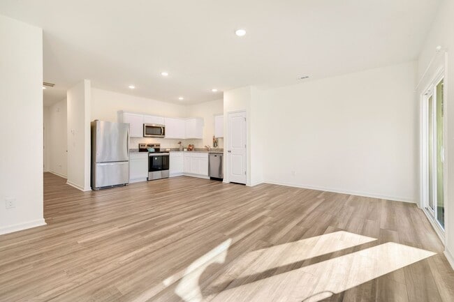 Building Photo - Brand-new, end-unit townhome!