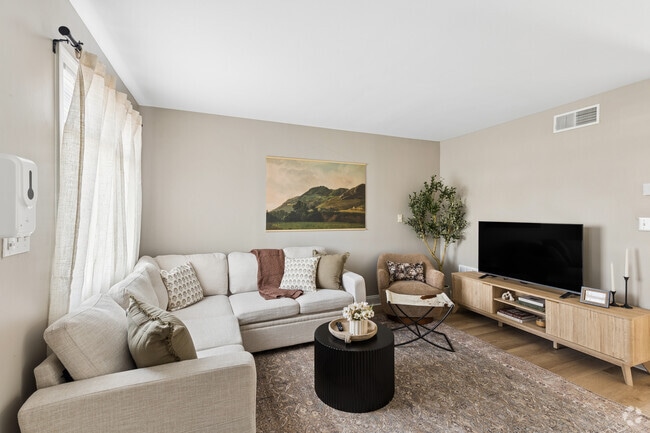 2BR, 1BA - 820SF (Phase 1) - Living Room - Emerald Gardens