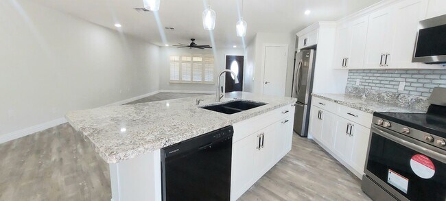 Building Photo - * UTILITIES INCLUDED * TOTALLY REMODELED 2X2