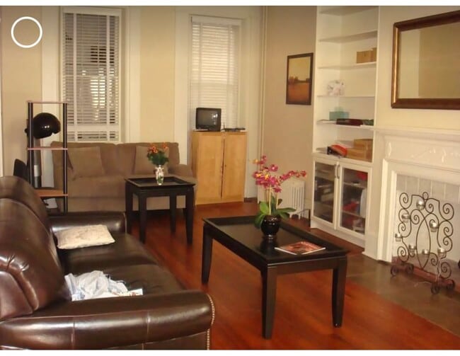 Great room with book shelves and cabinets - 832 Hollins St