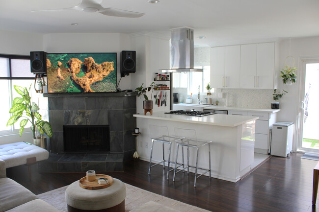 Open living, kitchen, dining area with kitchen island and pull up bar - 1315 Stanford St