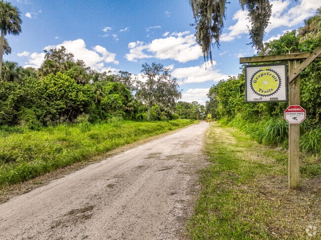 Palm Bay's bike trails with jumps & obstacles through the woods at Grapefruit Trails.