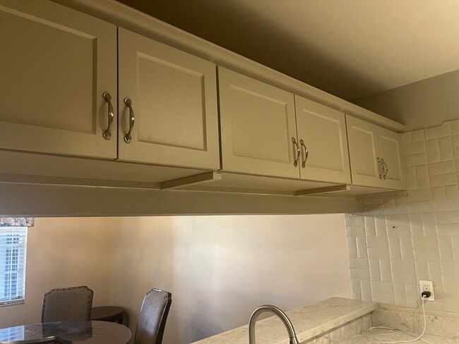 Newly refaced kitched cabinets - 3782 59th Ave W