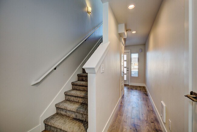 Building Photo - EASY CARE, HIGH EFFICIENCY TRI-LEVEL TOWNH...