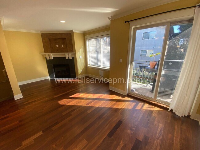 Building Photo - Spacious townhome with private backyard, garage parking, multiple decks, and a dedicated home off...