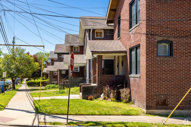 Older brick homes line the street and point to the history of the area.