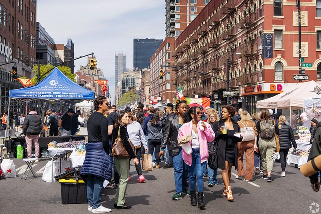 Residents stroll on closed streets during the Chelsea Spring Fair.