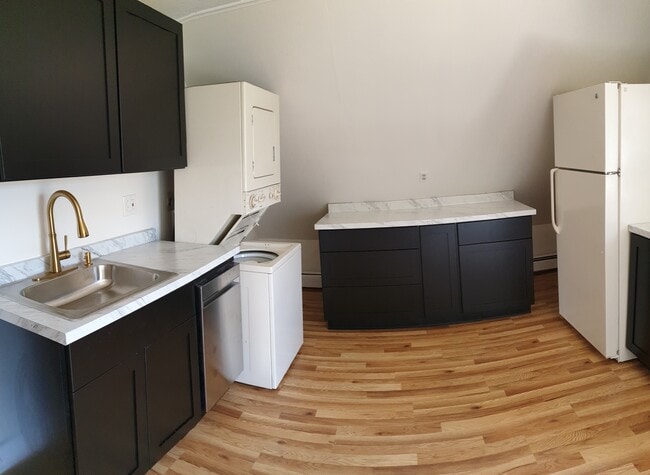Enjoy the ease of in-unit washer and dryer tucked right into your newly updated kitchen - 412 Morris Ave