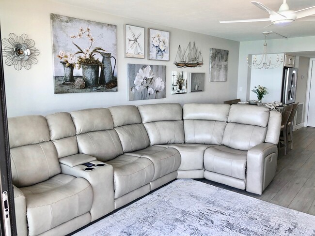 New Aviator sectional with top-grain leather, infinite reclining positions, powered headrests. - 26300 Hickory Blvd