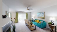 Located at 19860 Century Blvd in Germantown, Maryland, this single-floor apartment offers a thoughtfully designed layout with comfortable living spaces throughout. The living room serves as the heart of the unit, featuring soft carpeting, a ceiling fan, and a sliding glass door that opens to a private balcony, allowing natural light to fill the space. A fireplace with a clean, dark surround adds a distinctive focal point, complemented by vaulted-style white walls that lend an open, airy feel. The kitchen is outfitted with dark shaker-style cabinetry, granite countertops, a classic subway tile backsplash, and stainless steel appliances including a gas range, creating a functional and stylish cooking environment. Wood-style flooring anchors the kitchen area. The unit includes two bedrooms, each with plush carpeting and ample natural light. The primary bedroom features large windows and generous space, while the secondary bedroom offers a cozy, well-proportioned layout. Two bathrooms serve the unit — one with a walk-in shower and dark vanity cabinetry, and another with a soaking tub/shower combination, both finished with wood-style flooring and bright vanity lighting. The overall aesthetic is clean and modern, with neutral tones throughout.