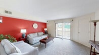 Located at 100 Fox Meadow Dr in Maple Shade, NJ, this 2-bedroom, 1-bathroom residence offers a thoughtfully arranged single-floor layout with a comfortable mix of living spaces. The living room is a standout area, featuring bold red accent wall, plush carpeting, and sliding glass doors with vertical blinds that open to a private patio, allowing natural light to fill the room. Adjacent to the living room, the dining area provides an intimate setting with carpeted flooring and ample wall space. The galley-style kitchen is well-appointed with dark espresso shaker cabinetry, granite-style countertops, light wood-look flooring, and black stainless appliances including a gas range and dishwasher. The spacious primary bedroom offers carpeted floors, a large window with sheer curtains, and generous closet storage. The second bedroom is similarly comfortable with its own closet access. The full bathroom features a clean, tiled tub-shower combination. With four closets distributed throughout, storage is plentiful. Two hallways connect the spaces efficiently, rounding out a functional and cohesive floor plan suited for everyday living.