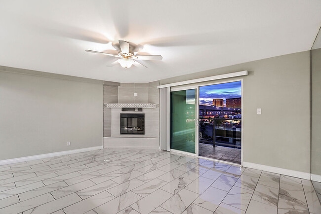 Living Room with Fireplace and View - Country Club Towers