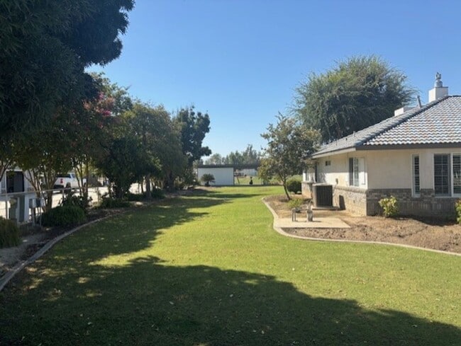 Building Photo - Spacious 4-Bedroom Home on 2.5 Acres with ...