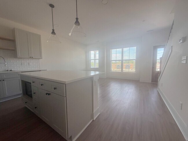 Building Photo - 3-Bedroom Highbury Townhome with Flex Room | Modern Living + Resort-Style Amenities