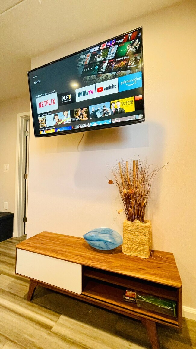 Wall mounted TV on swivel stand - 1051 Columbus Dr