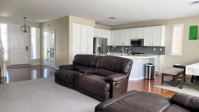 Living room, kitchen and dining - 743 W Bel Esprit Cir