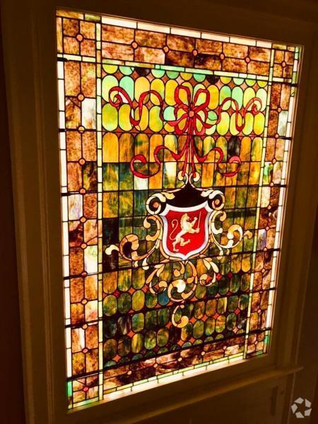 Original stained glass crest - 1049 Franklin Ave