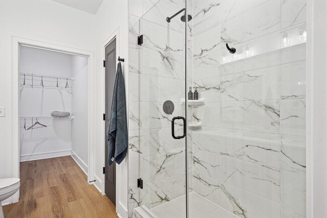Bathroom with Quartz Countertops, Double Vanity Sinks, Walk-in Shower, and Walk-in Closet - Cendana Craig Ranch
