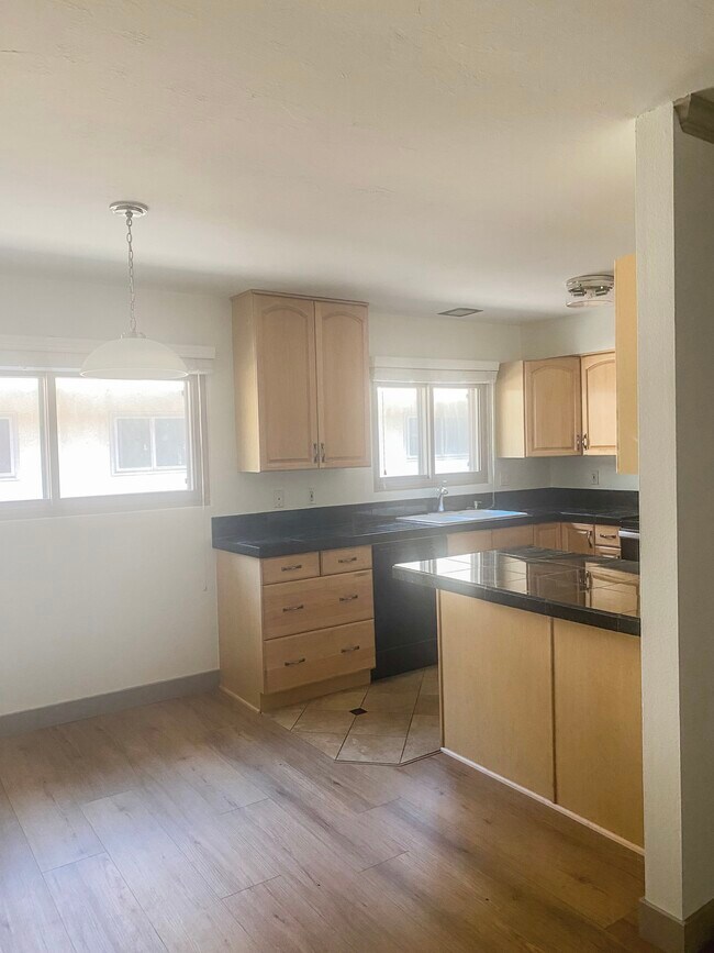 Kitchen open to dining room - 2666 Worden St