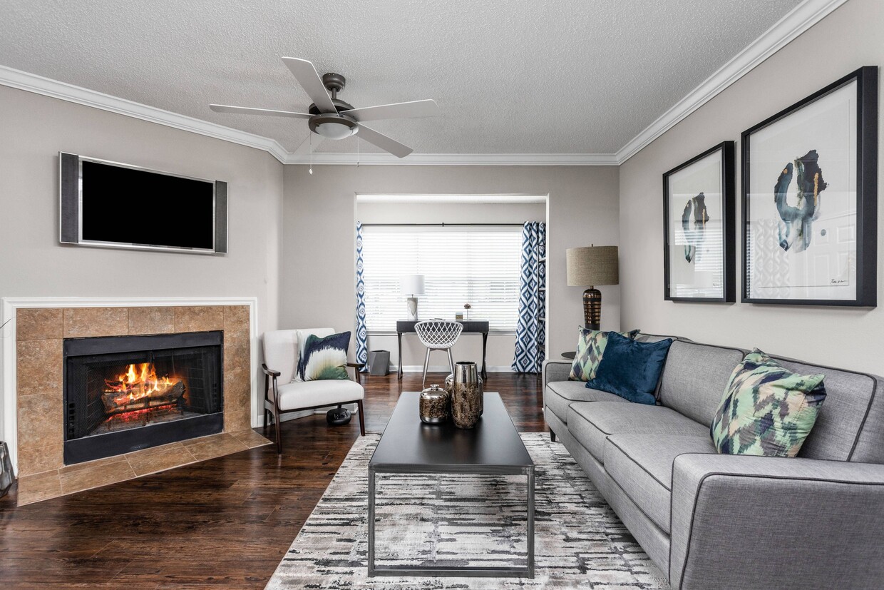 Living Room with Fireplace - Arbors River Oaks Apartments