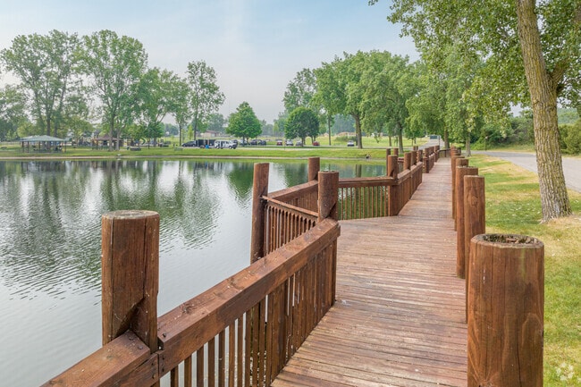 Enjoy a scenic view from the boardwalk running along the Huizenga Park pond in Zeeland.