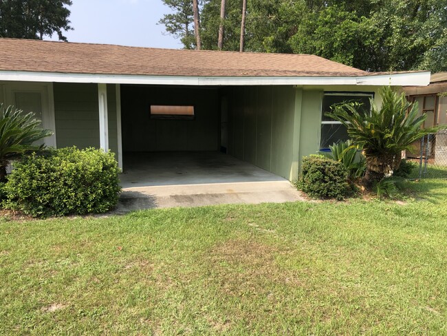 Carport avail. Storage shed to the right, is not. - 1918 Lamar Ave