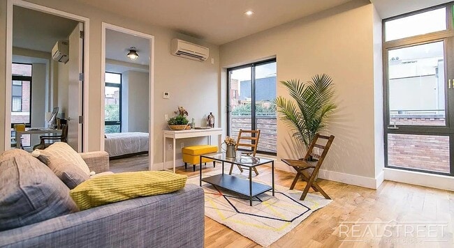Building Photo - Bright 2 Bed / 1 Bath Loft-Style Residence with Multiple Balconies & Premium Amenities