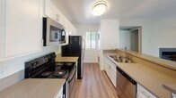 Located at 10757 Lemon Ave in Rancho Cucamonga, CA, this single-floor residence offers a well-designed, functional layout with a clean, modern aesthetic throughout. The open-concept living and dining area is anchored by wood-look flooring, neutral-toned walls, a ceiling fan, and a tiled fireplace, creating a warm yet contemporary atmosphere. A sliding glass door allows natural light to pour in while providing access to an outdoor area with views of surrounding greenery.

The galley-style kitchen is thoughtfully appointed with crisp white cabinetry, stainless steel appliances including a refrigerator, electric range, microwave, and dishwasher, along with a double-basin sink and a peninsula counter that opens to the living space — ideal for both cooking and entertaining.

The bedroom features plush carpeting, soft neutral walls, and a spacious sliding-door closet with built-in shelving, offering ample storage. The bathroom is clean and efficiently designed, with wood-look flooring, a full tub-and-shower combination with a curved curtain rod, and a vanity with counter space. Throughout the residence, the consistent use of light tones, updated finishes, and practical layouts contribute to a bright, move-in-ready environment well-suited for comfortable everyday living.
