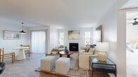 Located in Mesa, Arizona, this single-story 3-bedroom, 2-bathroom home offers a thoughtfully designed layout across a compact yet efficient floor plan. The bright and airy living room serves as the heart of the home, featuring a wood-burning fireplace, wood-look flooring, and multiple windows with vertical blinds that invite natural light. The galley-style kitchen is well-equipped with white shaker cabinetry, quartz countertops, gold-toned hardware, a deep stainless steel sink, and a full suite of stainless steel appliances including a refrigerator, dishwasher, and electric range. The bedrooms are carpeted for comfort and include ceiling fans and windows providing natural light and outdoor views. The primary bedroom offers a generous footprint with ample natural light. Both bathrooms are fitted with white vanities, quartz countertops, and tub-shower combinations with curtain enclosures, finished with wood-look tile flooring. A dedicated in-unit laundry room with shelving provides added convenience. A hallway connects all rooms efficiently, and two closets offer additional storage. The home's clean, neutral palette and consistent finishes create a cohesive and functional living environment throughout.