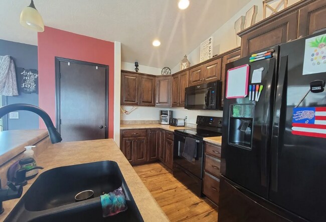 Building Photo - Spacious 4BR Home with Walkout Deck & Attached Garage!