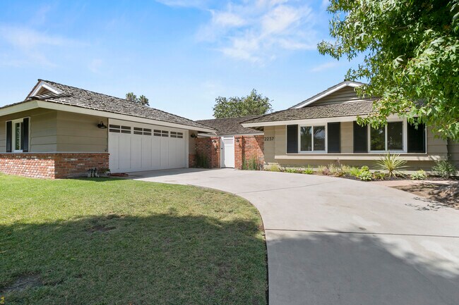 Long driveway, attached 2-car garage with direct access into home and gated courtyard entry - 2237 Donnie Rd