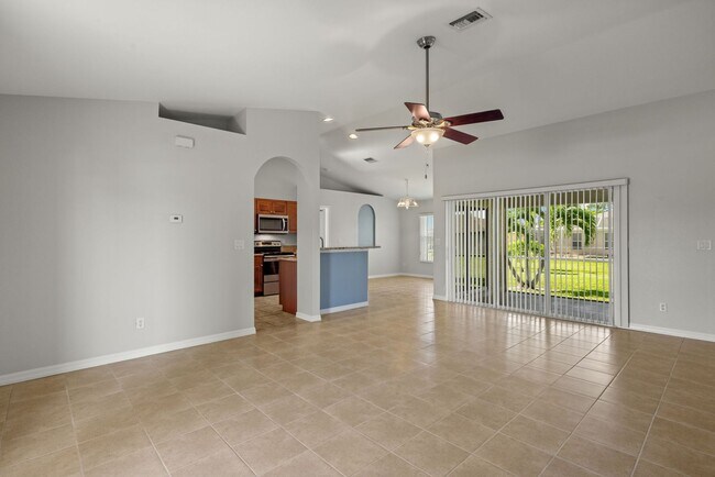 Building Photo - This Beautiful SW 3/2/2 Home is move-in re...