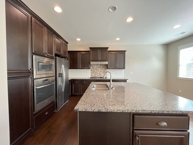 Building Photo - Spacious 4-Bedroom + Bonus Room with Modern Kitchen, Solar Panels & Private Fenced Backyard!