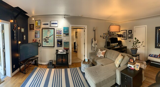 Track lighting makes for a great gallery wall. - 636 N Washington St