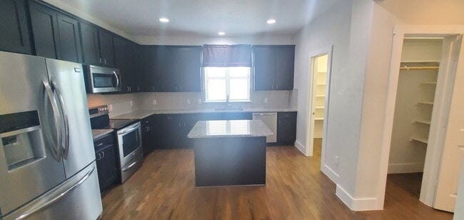 Photo - Energy Efficient Urban Townhome w/ Open Floorplan, Gourmet Kitchen, Rooftop Patio, & Exall Park N...