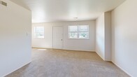 Located at 31 Peters Ln in Blackwood, NJ, this single-floor home offers three bedrooms, one full bathroom, a hallway, and a dedicated closet. The layout is straightforward and functional, with neutral-toned walls and wall-to-wall carpeting throughout the bedroom areas, creating a clean and cohesive look. The spacious primary bedroom benefits from multiple windows that allow natural light to fill the room, and features direct access to additional spaces. Two secondary bedrooms are similarly carpeted and well-lit, with one room showcasing distinctive vertical shiplap-style wall paneling that adds a subtle design element. A louvered bi-fold closet provides built-in storage in one of the bedrooms, complemented by crown molding details. The bathroom is finished with tile flooring and includes a full tub and shower combination with tiled surround accented by a decorative mosaic border. A hallway connects the rooms, maintaining an efficient flow throughout the home. The overall aesthetic is bright, neutral, and move-in ready, offering a practical and comfortable living environment in a residential Blackwood neighborhood.
