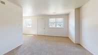 Located at 31 Peters Ln in Blackwood, NJ, this single-floor home offers three bedrooms, one full bathroom, a hallway, and a dedicated closet. The layout is straightforward and functional, with neutral-toned walls and wall-to-wall carpeting throughout the bedroom areas, creating a clean and cohesive look. The spacious primary bedroom benefits from multiple windows that allow natural light to fill the room, and features direct access to additional spaces. Two secondary bedrooms are similarly carpeted and well-lit, with one room showcasing distinctive vertical shiplap-style wall paneling that adds a subtle design element. A louvered bi-fold closet provides built-in storage in one of the bedrooms, complemented by crown molding details. The bathroom is finished with tile flooring and includes a full tub and shower combination with tiled surround accented by a decorative mosaic border. A hallway connects the rooms, maintaining an efficient flow throughout the home. The overall aesthetic is bright, neutral, and move-in ready, offering a practical and comfortable living environment in a residential Blackwood neighborhood.
