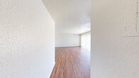 This 1050 square foot apartment, located in Summit West - 38C - C2, offers a well-designed living space with three bedrooms and two bathrooms. The primary bedroom is generously sized at 170 square feet, providing ample space for relaxation. The open-concept layout seamlessly integrates the kitchen and living room, creating a spacious feel ideal for both daily living and entertaining.

The kitchen boasts oak cabinetry, stainless steel appliances, and ample counter space, perfect for culinary enthusiasts. The bathrooms feature clean, white fixtures and wood-look flooring, blending functionality with style. A dedicated laundry room adds convenience to daily chores.

Throughout the apartment, wood-look flooring adds warmth and durability. Large windows in the bedrooms and living areas allow for natural light, enhancing the overall ambiance. The neutral color palette provides a blank canvas for personal decor preferences.

With three closets, storage space is plentiful. The apartment's single-floor layout ensures easy accessibility for all residents. This well-appointed home strikes a balance between comfort and practicality, making it an ideal choice for small families or individuals seeking a spacious living environment.