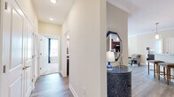 Located at 5150 Jack Byrnes Dr in Murfreesboro, TN, this thoughtfully designed 2-bedroom, 2-bathroom single-floor home offers a comfortable and cohesive layout with quality finishes throughout. The living room features crown molding, large windows with natural light, and wood-style flooring, creating a warm and inviting atmosphere. Adjacent to it, the dining area provides an intimate space for meals, while the kitchen is equipped with rich dark cabinetry, granite-style countertops, and stainless steel appliances, including a full-size refrigerator. The primary bedroom is a well-proportioned retreat with plush carpeting, multiple windows, a ceiling fan, and access to a dedicated closet. The second bedroom mirrors this comfort with carpet flooring, natural light, and its own closet. Both bathrooms are finished with wood-style tile flooring, dark vanity cabinetry with stone countertops, and tub-shower combinations. A connecting hallway with recessed lighting and additional closet storage provides practical flow between rooms. Neutral tones and consistent trim details throughout lend the home a clean, polished character from entry to end.