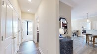 Located at 5150 Jack Byrnes Dr in Murfreesboro, TN, this thoughtfully designed 2-bedroom, 2-bathroom single-floor home offers a comfortable and cohesive layout with quality finishes throughout. The living room features crown molding, large windows with natural light, and wood-style flooring, creating a warm and inviting atmosphere. Adjacent to it, the dining area provides an intimate space for meals, while the kitchen is equipped with rich dark cabinetry, granite-style countertops, and stainless steel appliances, including a full-size refrigerator. The primary bedroom is a well-proportioned retreat with plush carpeting, multiple windows, a ceiling fan, and access to a dedicated closet. The second bedroom mirrors this comfort with carpet flooring, natural light, and its own closet. Both bathrooms are finished with wood-style tile flooring, dark vanity cabinetry with stone countertops, and tub-shower combinations. A connecting hallway with recessed lighting and additional closet storage provides practical flow between rooms. Neutral tones and consistent trim details throughout lend the home a clean, polished character from entry to end.