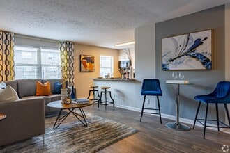 Spacious living room with hardwood-style flooring - Union at JTown